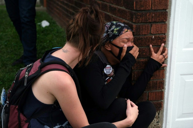 A protester cries during the demonstration in Louisville, Kentucky, on September 23, 2020, when thousands of people flooded the city's streets to protest the Taylor verdict