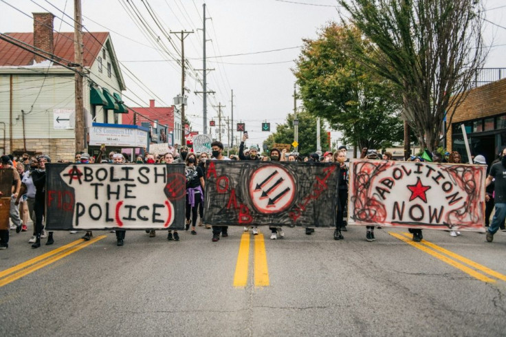 Demonstrators march in the street following the grand jury decision in the Breonna Taylor case