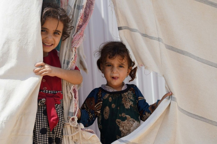 Girls look out from a tent at the Suweida makeshift camp for internally displaced people in Yemen's Marib province which had been a sanctuary for many in the early years of Yemen's five-year war