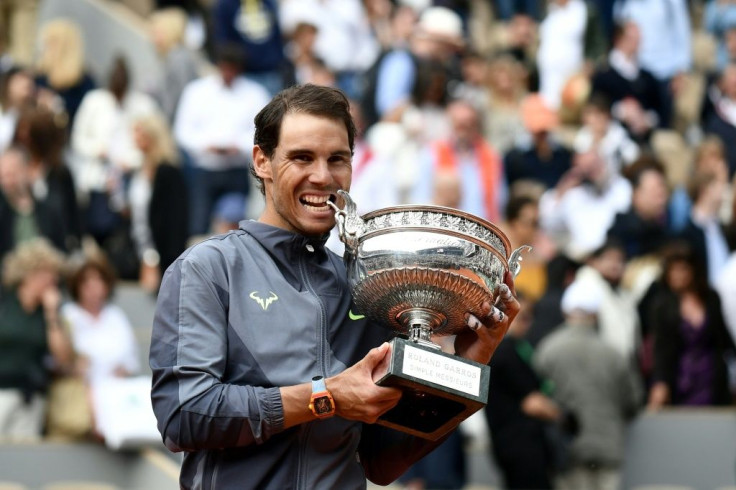 Rafael Nadal poses with the Coupe des Mousquetaires after winning the men's 2019 French Open final