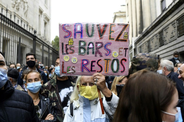 A protester with a sign that reads "Save bars and restaurants" during a demonstration in Marseille, southern France, on Friday.