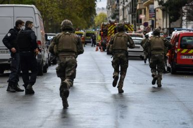Security forces cordoned off the area near the former offices of satirical weekly Charlie Hebdo in Paris on Friday.