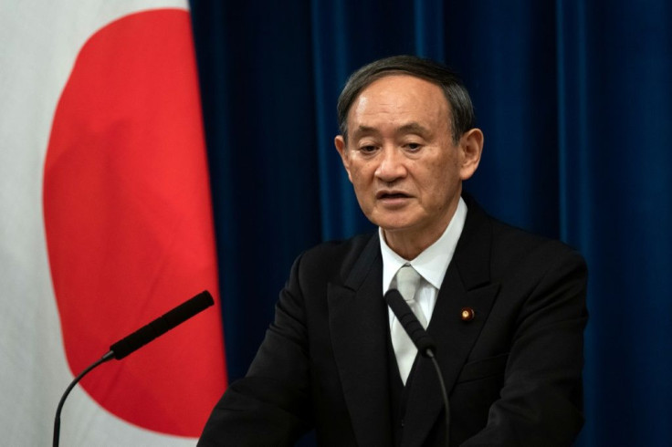 Japan's new Prime Minister Yoshihide Suga, seen here at his first press conference on September 16, 2020, has vowed to go ahead with the Olympic Games despite uncertainties over the coronavirus pandemic