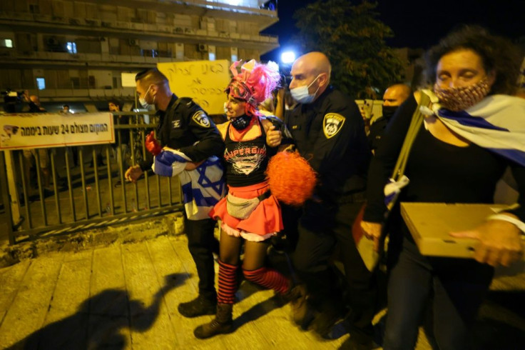 Israeli demonstrators marched on the streets of Jerusalem in front of Prime Minister Benjamin Netanyahu's residence on Saturday despite a nationwide virus lockdown