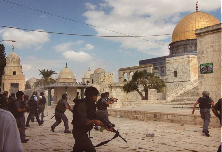 In this September 2000 photo, Israeli riot police take position inside Jerusalem's Al-Aqsa mosque compound during clashes with Palestinians