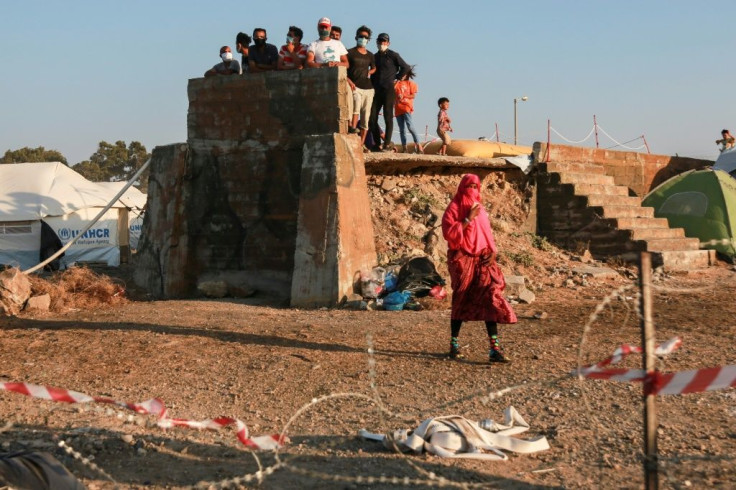 Migrants' tents are surrounded by barbed wire at a Lesbos facility built after an overcrowded camp burned down