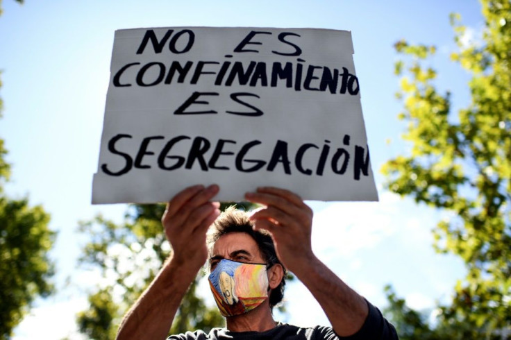 One sign at the Madrid protest accused authorities of "segregation"