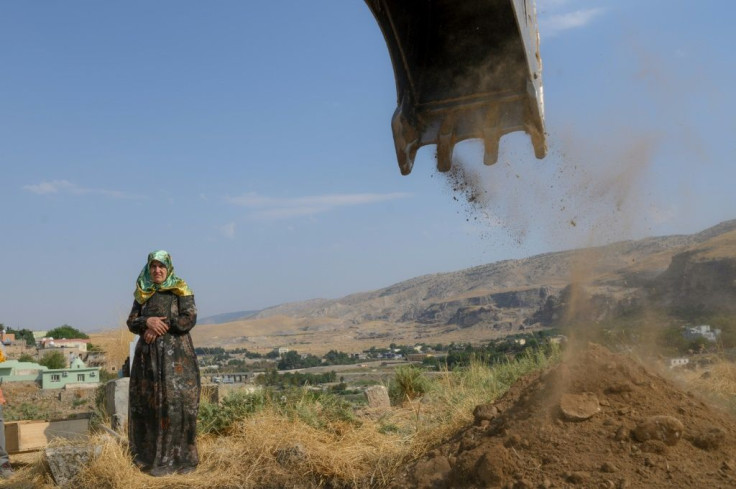 Some of the town's 3,000 residents lament the 500 or so graves that had to be exhumed and urgently moved to higher ground last September