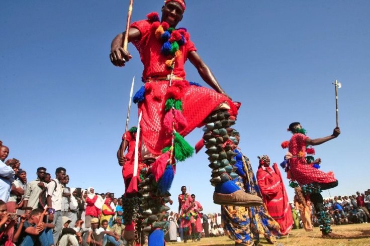 Dancers in Sudan's capital Khartoum celebrate on the anniversary of the uprising that toppled president Omar al-Bashir -- now many who fled are returning