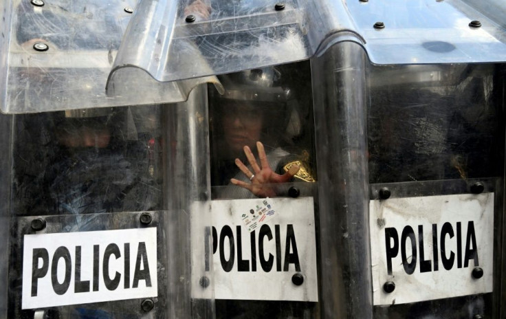 Riot police protect themselves during clashes with supporters of the legalization of abortion nationwide in Mexico, in Mexico City