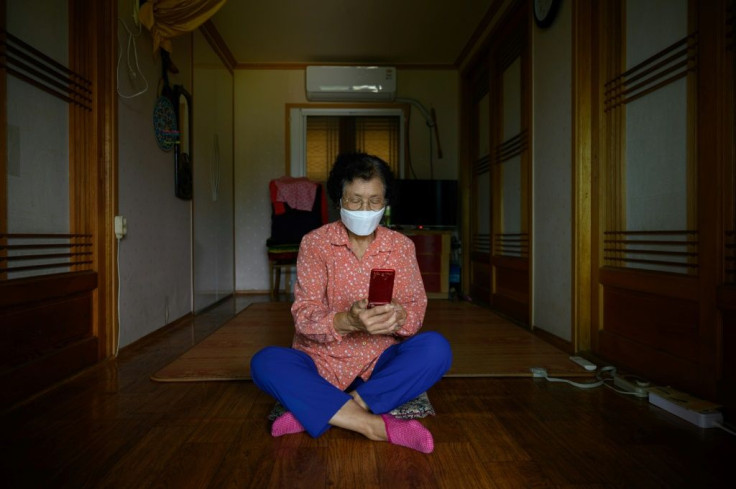 Sitting in her tiny home, 83-year-old Moon Haeng-ja is struggling to master a new skill as the pandemic plays havoc with South Korea's harvest celebrations: making video calls