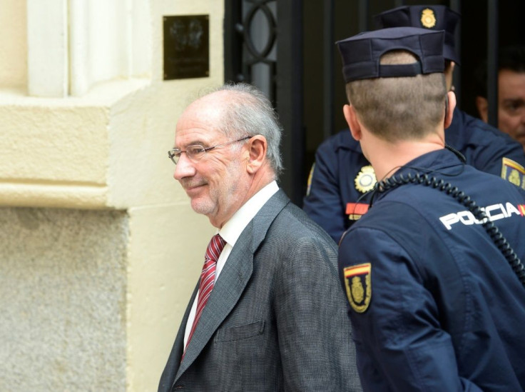 Former IMF head Rodrigo Rato, who was acquitted over fraud charges related to the 2011 listing of Bankia bank, had always maintained that the authorities were fully aware of what happened at the bank(L) smiles as he leaves his office.Former IMF chief R
