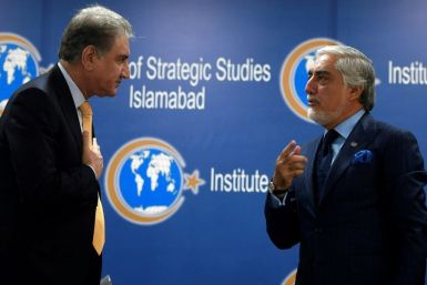 Pakistan's Foreign Minister Shah Mahmood Qureshi (left) listens to Chairman of the High Council for National Reconciliation of Afghanistan Abdullah Abdullah at an Institute of Strategic Studies meeting in Islamabad