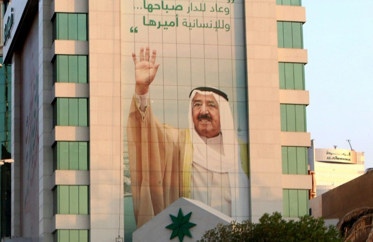 A portrait of Sheikh Sabah emblazoned on the side of a building in September last year