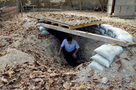 A man emerges from a makeshift bomb shelter in the village of Sahlabad outside the Azerbaijani city of Tartar