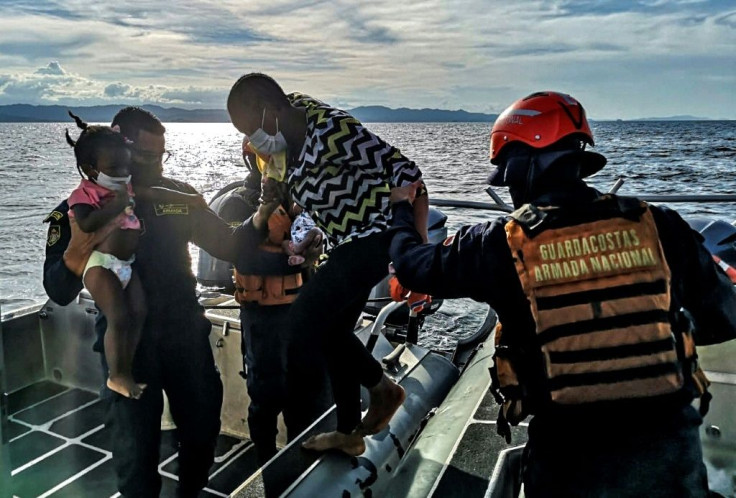 Colombian naval personnel rescuing Haitian migrants after their boat was drifting off the coast of Acandi, in the country's department of Choco, in September 2020