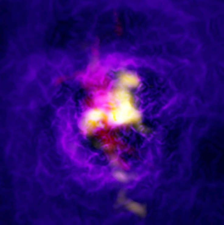 A handout photo released  by the European Southern Observatory shows a composite image of the Abell 2597 galaxy cluster depicting the fountain-like flow of gas powered by the supermassive black hole in the central galaxy