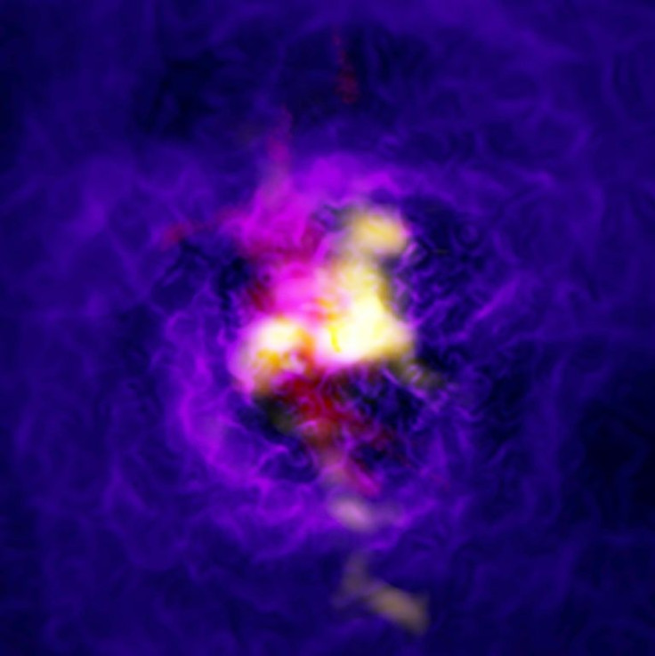 A handout photo released by the European Southern Observatory shows a composite image of the Abell 2597 galaxy cluster depicting the fountain-like flow of gas powered by the supermassive black hole in the central galaxy