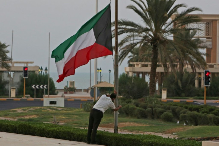 The Kuwaiti flag is lowered to half-mast as the emirate begins 40 days of national mournign for their leader of 14 years