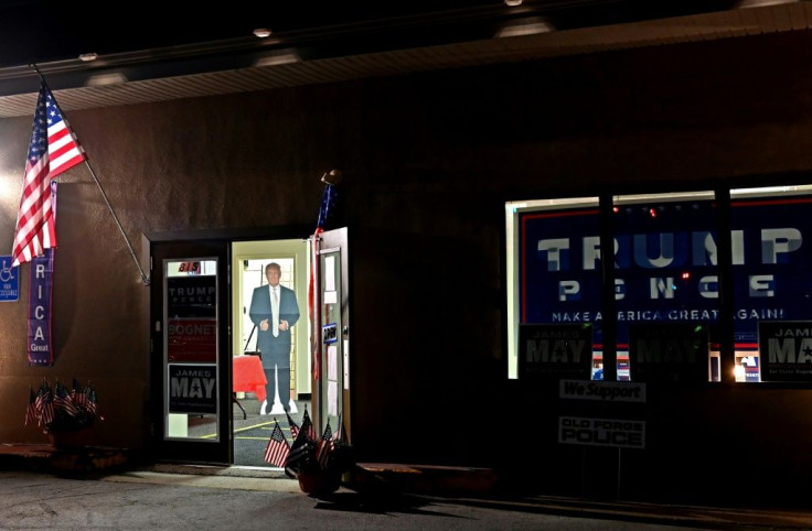 A life-sized Trump cardboard cutout welcomes those gathering to watch