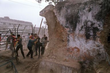 Hindu fundamentalists attacking the wall of the 16th Century Babri Masjid Mosque with iron rods in Ayodhya in December, 1992