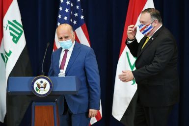Iraq's foreign minister holds talks with Secretary of State Mike Pompeo in Washington last month before a surge of attacks on US interests prompted a US pullout ultimatum