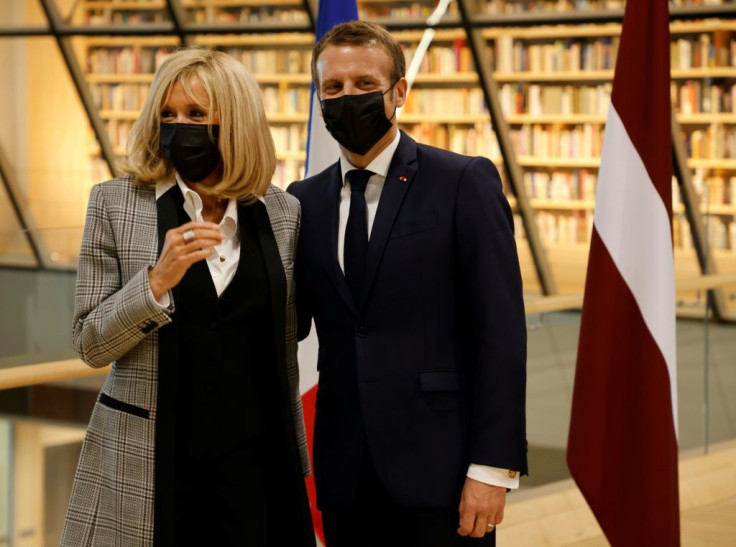 French President Emmanuel Macron, seen with his wife Brigitte, sought to allay Baltic concerns in defending his support for dialogue with Russia