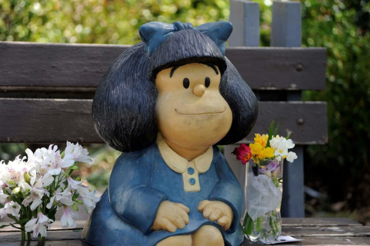 Flowers left by members of the public at a statue of Mafalda in Buenos Aires, after the announcement of the death of her cartoonist creator Quino