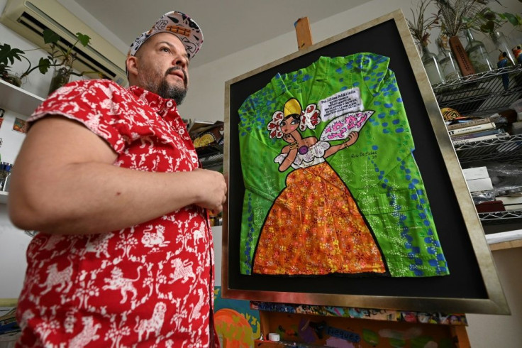 Panamanian artist Rolando De Sedas poses with his creation, made from a doctor's coat