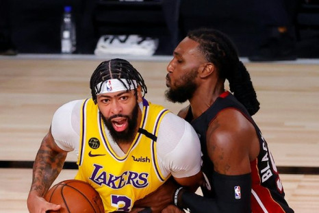 Lakers star Anthony Davis drives the ball against Jae Crowder of the Miami Heat in a dominant NBA Finals debut
