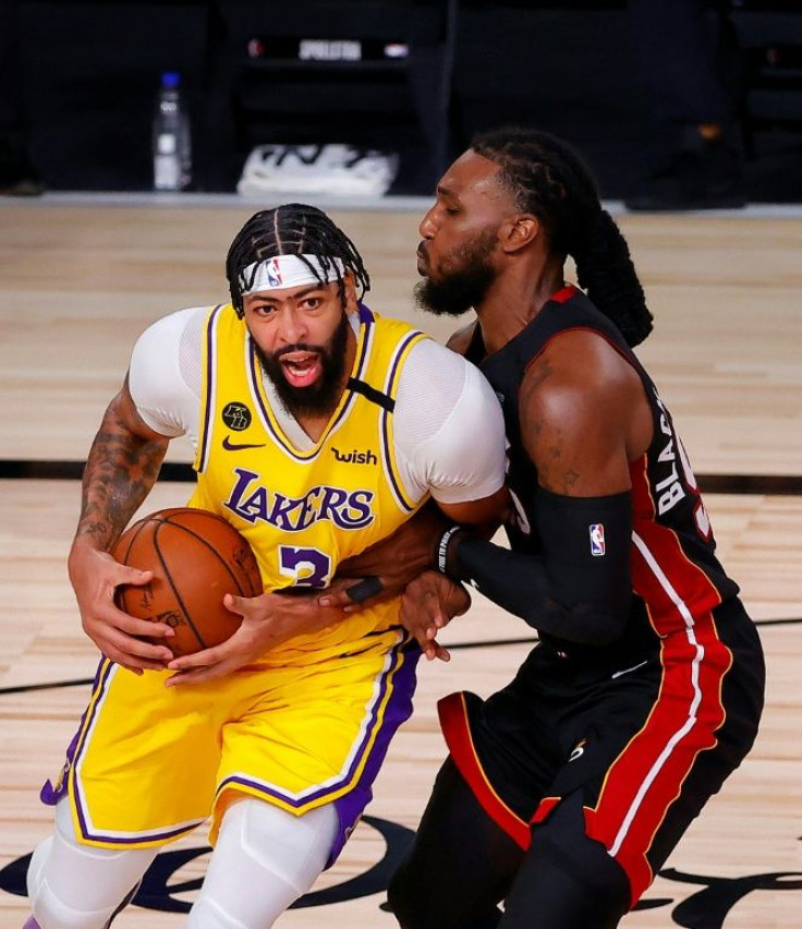Lakers star Anthony Davis drives the ball against Jae Crowder of the Miami Heat in a dominant NBA Finals debut