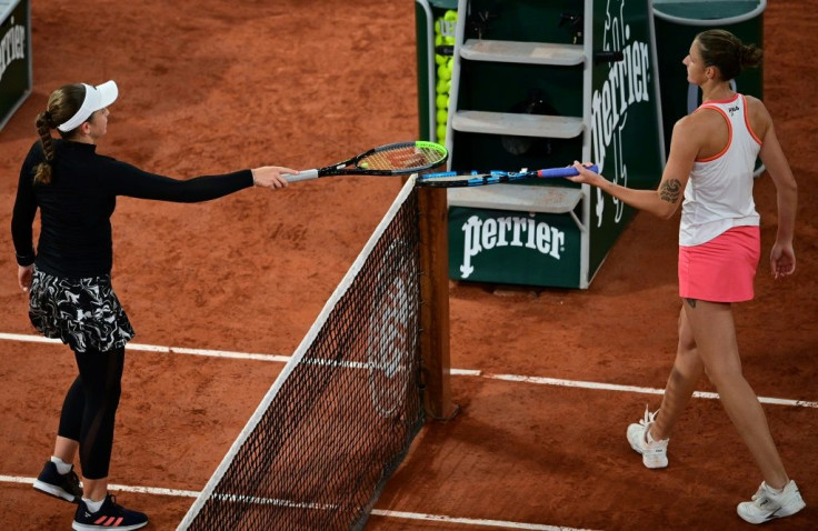 Tapping out: Jelena Ostapenko with Karolina Pliskova at the end of Thursday's match