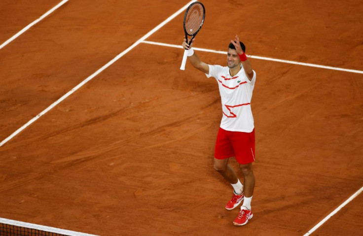 Easy does it: Novak Djokovic celebrates after victory over Mikael Ymer in the first round