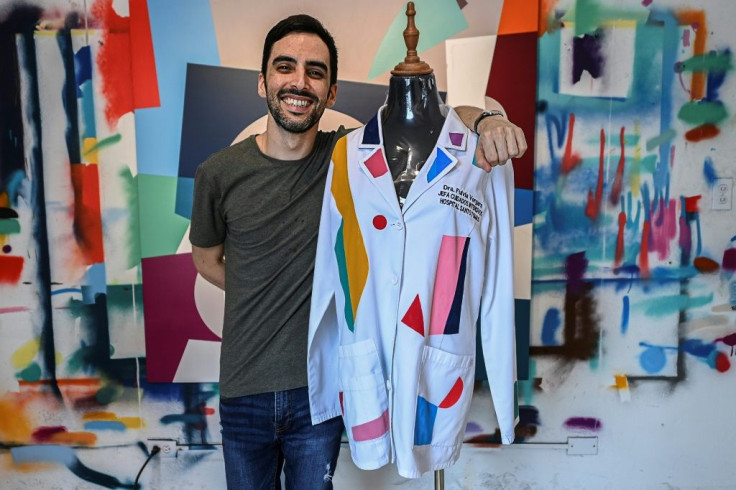 Panamanian artist Genaro Rodriguez said painting a doctor's coat for charity was like "painting a superhero's cape"
