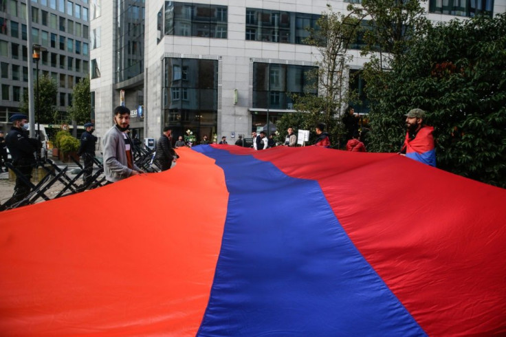EU leaders were weclomed to Brussels by protesters giant Armenian flag during a rally against the war in the Nagorny Karabach