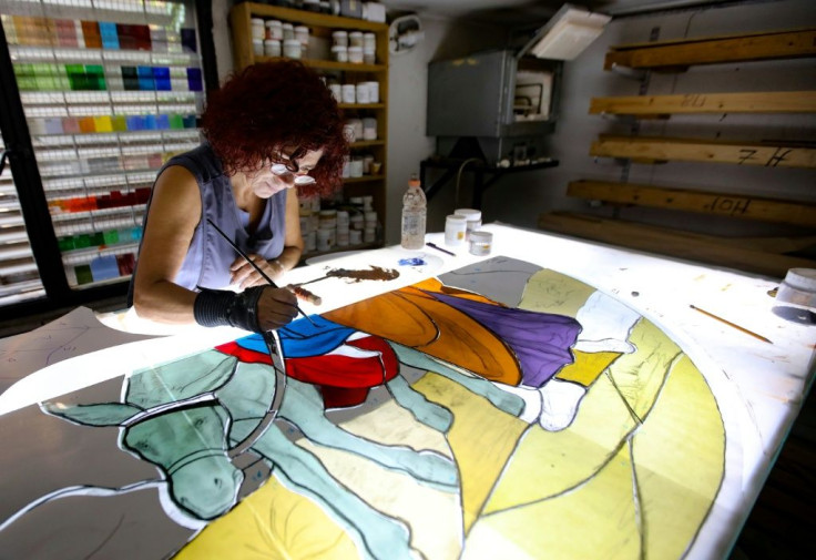 Lebanese stained glass artist Maya Husseini works on a window, one of several artists striving to restore artworks devastated in Beirut's blast disaster