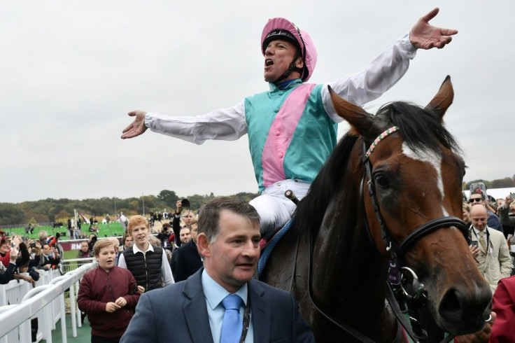 Frankie Dettori celebrates victory on Enable at the 2018 Prix de l'Arc de Triomphe