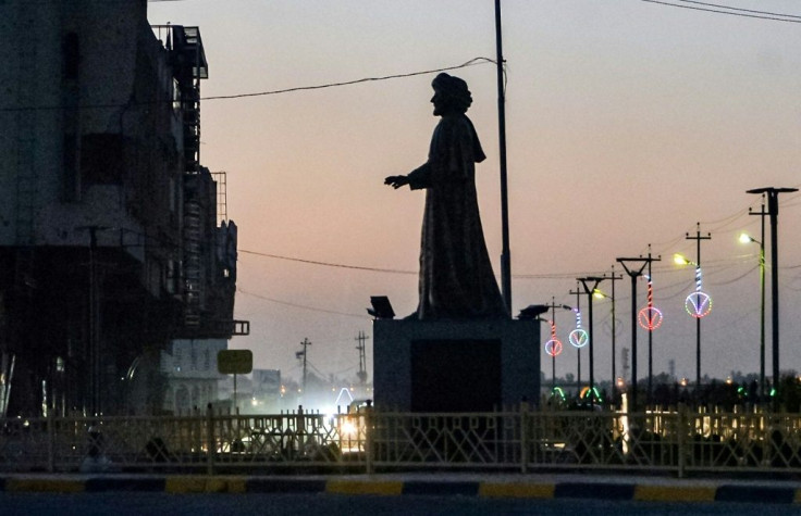 A statue of a local poet is one of a half-dozen works by local artists erected across the northern Iraqi city since the Islamic State group lost control of it three years ago
