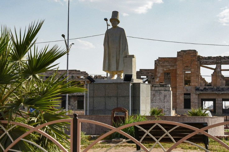A statue of Mulla Uthman, a Sufi poet from Mosul. The artworks are helping residents shake off memories of brutal punishments meted out by IS in squares and roundabouts, even as much of their city remains in ruins