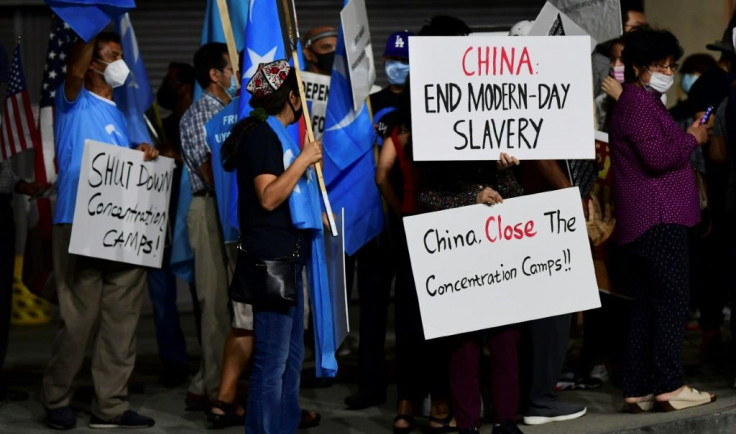 German Chancellor Angela Merkel accused China of "poor and cruel treatment" of its minorities and raised fears over the running crackdown on dissent in Hong Kong