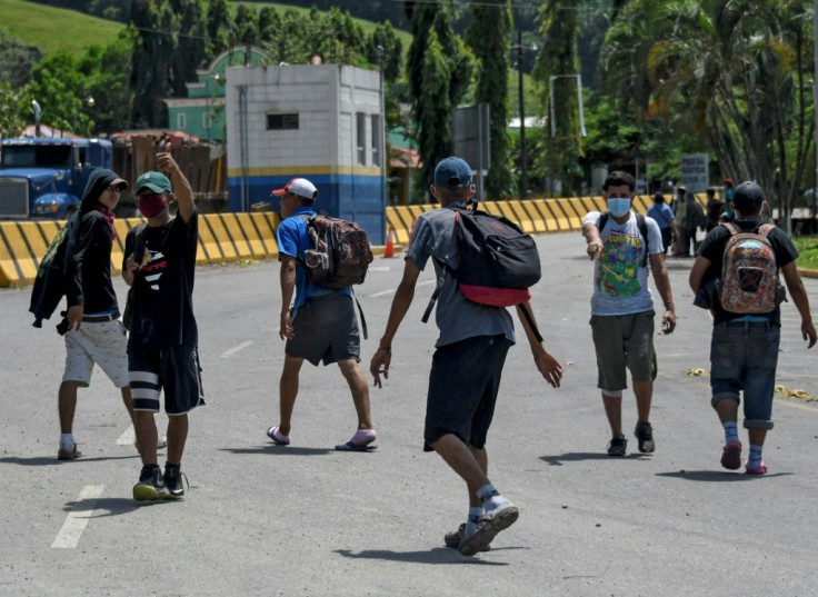 Honduran migrants who were heading in a caravan to the US are photographed as they voluntarily return to their country, in Corinto, Honduras, on October 3, 2020, after previously crossing into Guatemala