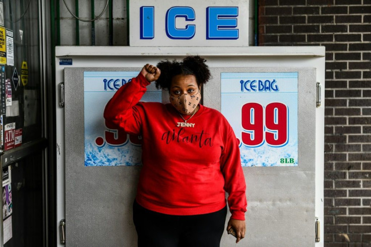 Jenny Beamer, 27, poses outside of a grocery store in Fayette, Mississippi