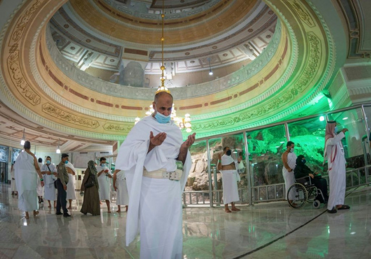Muslims perform the Umrah in the Grand Mosque complex in the holy city of Mecca, after Saudi authorities partially resumed the year-round pilgrimage with extensive health precautions imposed after a seven-month coronavirus hiatus