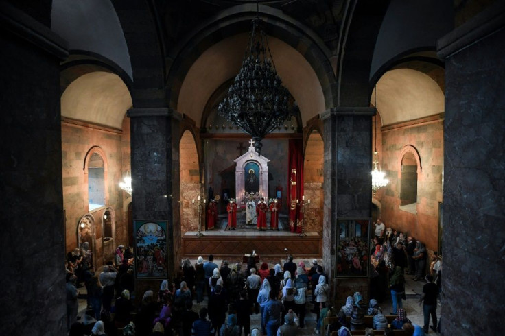 Armenian worshippers attend a Sunday service in Yerevan's Saint Sarkis church