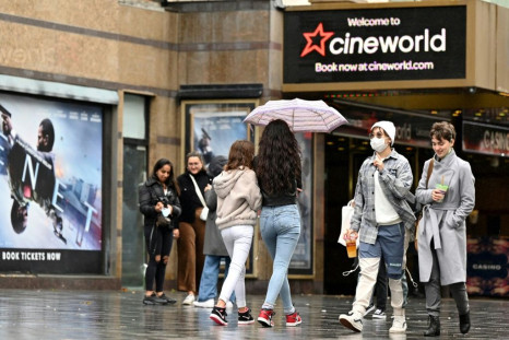 People walk past a cineworld cinema in Leicester Square, London