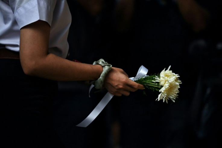 Flowers are laid for the victims of the Thammasat University massacre in October 1976, during the annual commemoration ceremony for the event at Thammasat University in Bangkok on October 6, 2020.