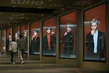 Posters showing BTS members outside a duty-free shop in Seoul