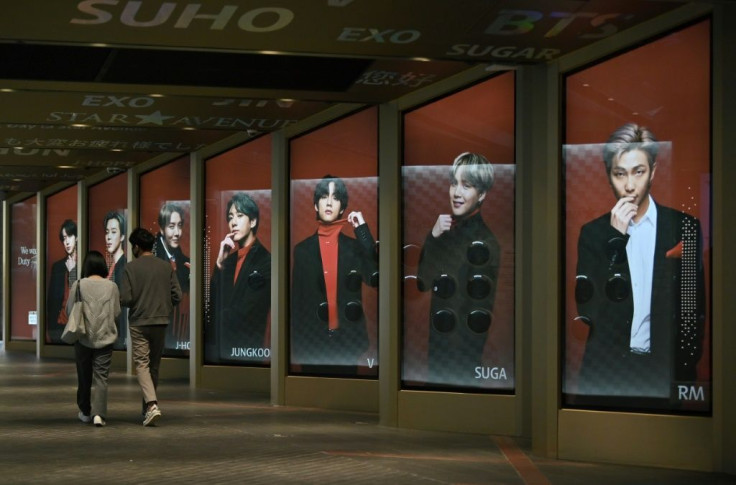 Posters showing BTS members outside a duty-free shop in Seoul