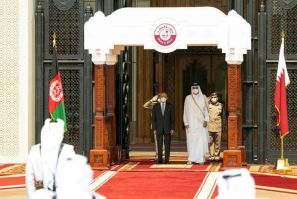 Qatar's ruler Emir Sheikh Tamim bin Hamad Al-Thani welcomes Afghan President Ashraf Ghani ahead of their meeting in the capital Doha