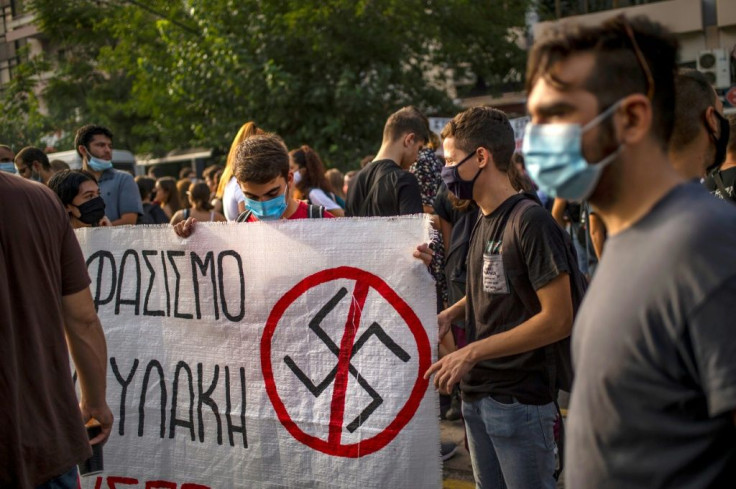 Some members of the crowd carried anti-fascist placards and shouted slogans denouncing the defendants